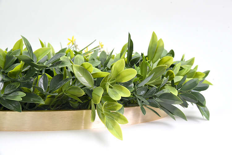 Artificial greenery in a gold decorative planter, perfect for DIY home decor and adding a touch of nature.