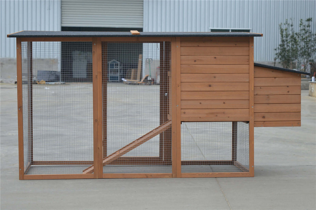 Large wooden chicken coop with mesh wire, perfect for affordable DIY pet housing.