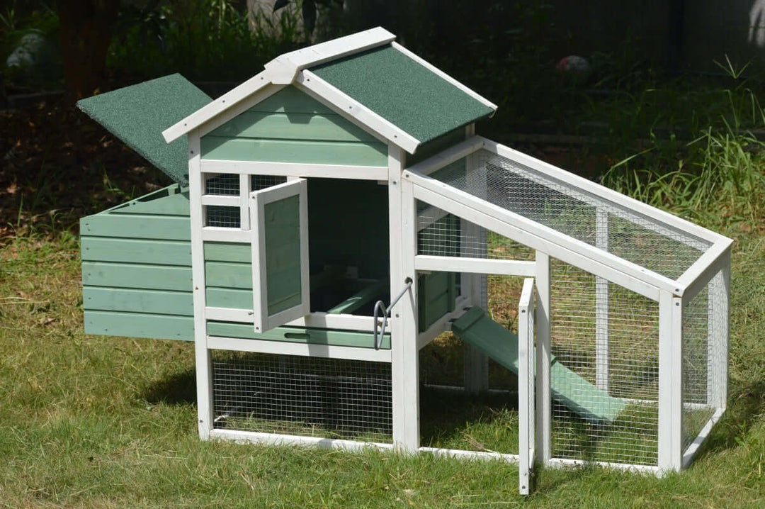 YES4PETS green small chicken coop with nesting box for 2 chickens or rabbits in a grassy area.