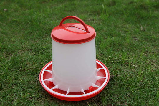 Affordable YES4PETS chicken water drinker on grass, durable plastic design with red accents.