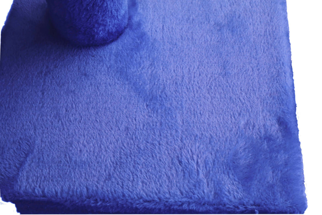 Plush blue fabric of a cat scratching post, providing a cozy and comfortable surface for cats to relax and scratch.