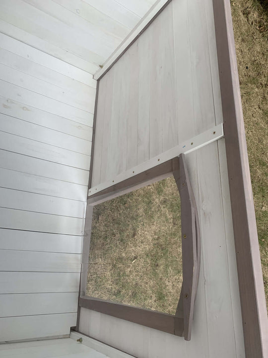 Interior view of YES4PETS wooden dog kennel showing elevated floor and access flap for ventilation.