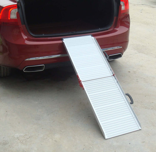 Portable foldable aluminium pet ramp for easy car access with non-slip surface.