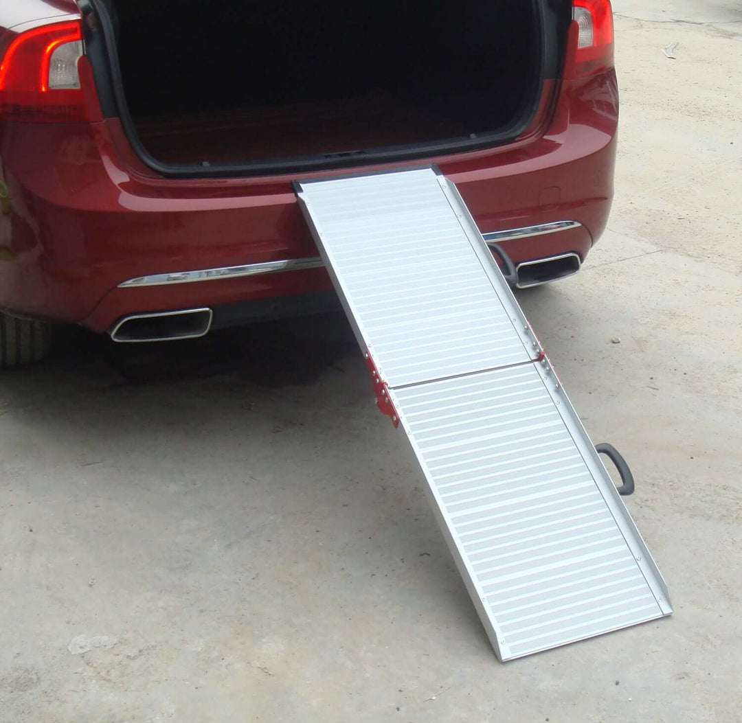 Portable aluminium pet ramp for easy access into car, suitable for dogs and small pets.