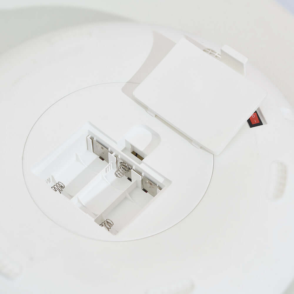 Interior view of 6 Meal Automatic Pet Feeder showing dual power supply compartment for batteries.