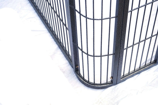 Close-up of the durable wrought iron frame of a bird, cat, or dog cage with a black finish.