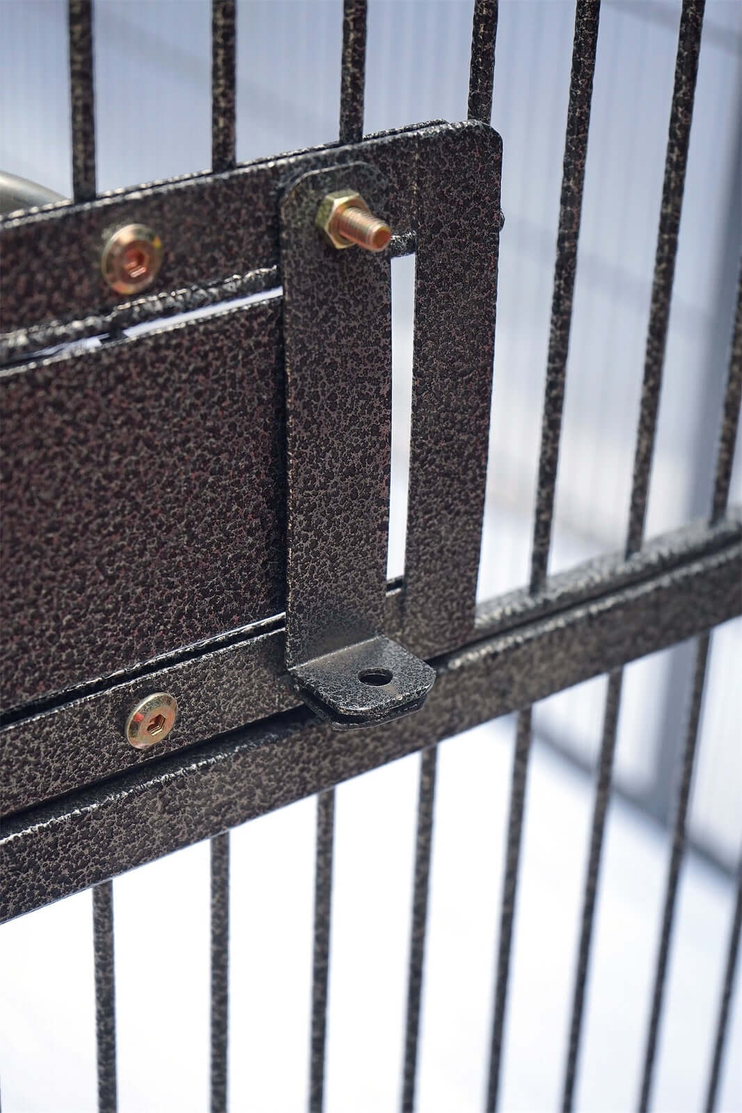 Close-up of secure lock mechanism on a durable bird and pet cage, showcasing quality craftsmanship and design.