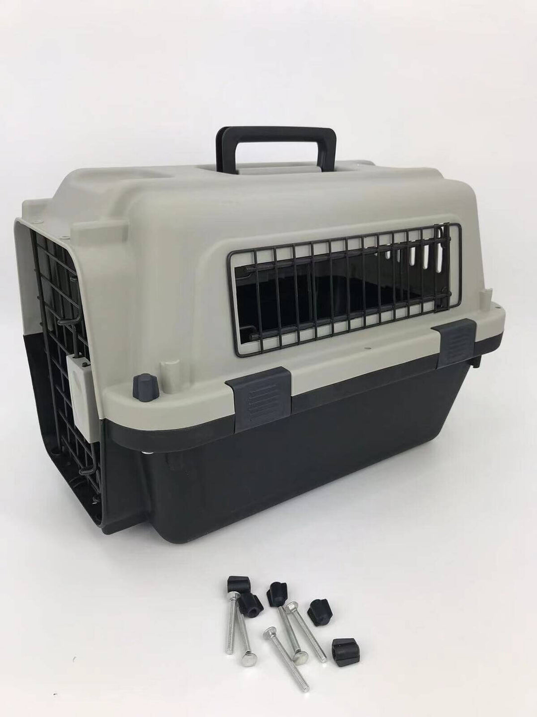 Grey medium pet carrier for dogs and cats with ventilation slots, ergonomic handle, and safety latches.