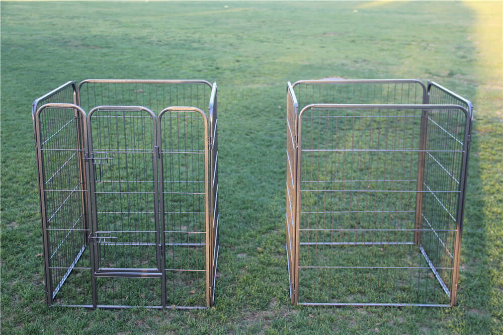 Two heavy-duty pet playpen panels on grass, ideal for dogs, cats, and rabbits; safe and versatile exercise area.