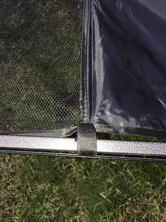 Close-up of YES4PETS playpen cover attachment showcasing quality mesh and durable metal frame in a green grass setting.