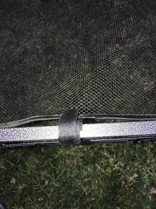 Close-up of YES4PETS heavy-duty pet playpen cover attachment showing secure fastening on grass.