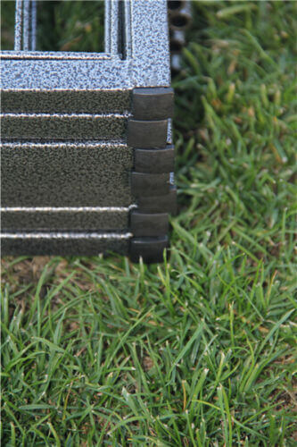 Close-up of the securing joints on a heavy-duty pet playpen on grass, showcasing quality construction.