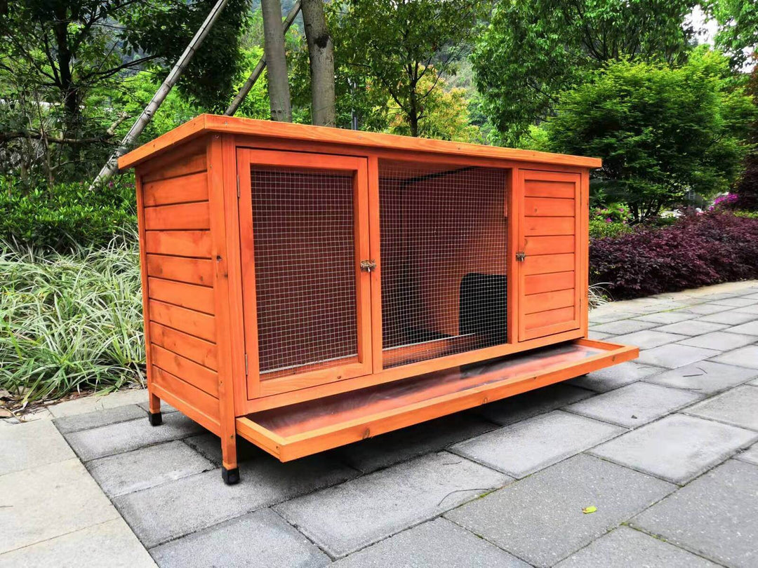 XXL rabbit hutch and guinea pig cage made of wood, featuring a pull-out tray and large access doors, suitable for small animals.