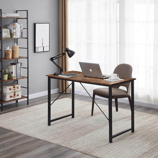 Modern computer desk in home office setting with laptop, table lamp, and chair, showcasing quality and affordable design.