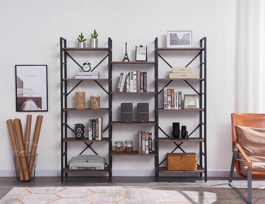 Industrial vintage bookshelf in a modern home setting with decorative items and a stylish armchair.