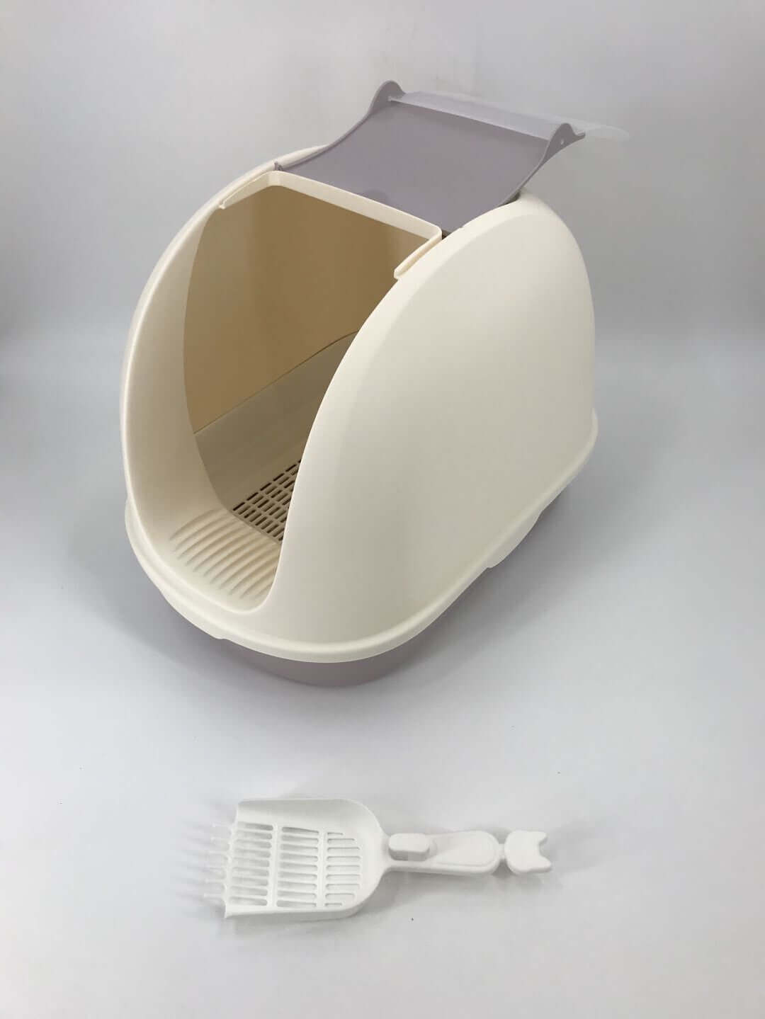 Portable hooded cat litter box in white with scoop, designed for privacy and easy cleaning, preventing litter scatter and odors.