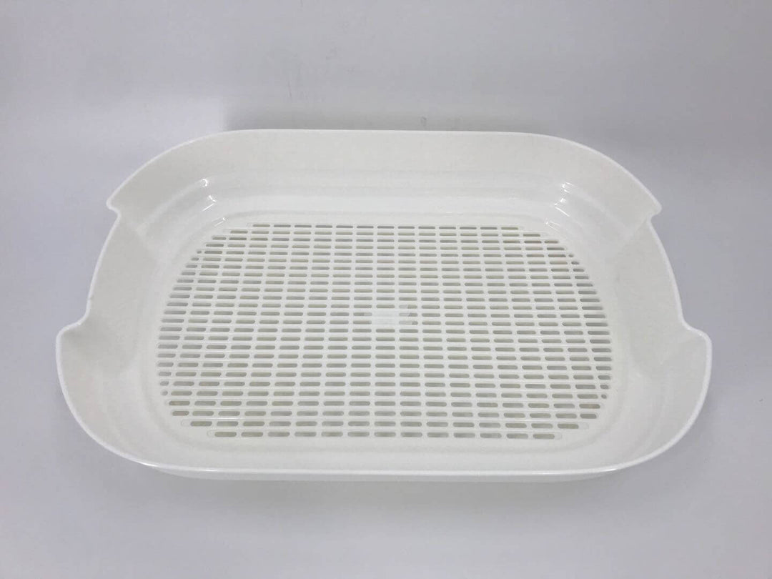 White grid tray for cat litter box, designed for easy waste removal and minimal mess.