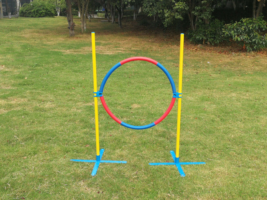 Affordable YES4PETS adjustable dog agility jump tyre for training and mental stimulation in a lush green yard.