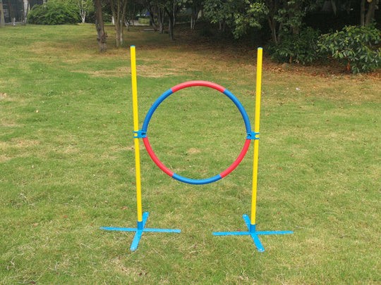 Affordable YES4PETS adjustable dog agility jump tyre for training and mental stimulation in a lush green yard.