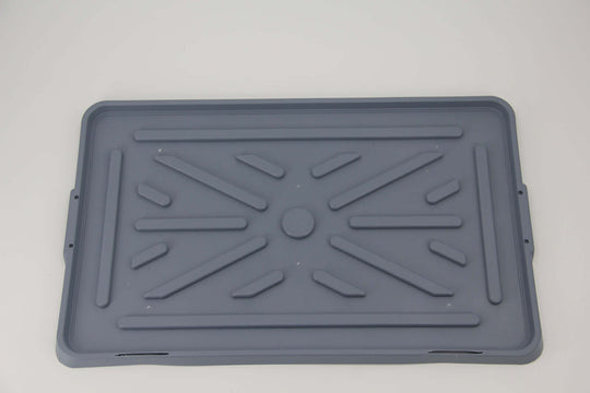 Gray removable waste tray for indoor dog potty training mat, easy to clean and durable design.