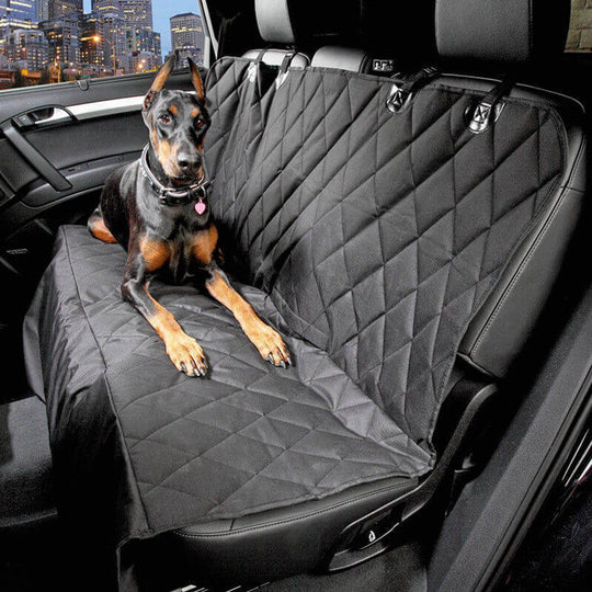 Dog reclining on a waterproof, non-slip back seat cover for cars, protecting against hair and scratches.