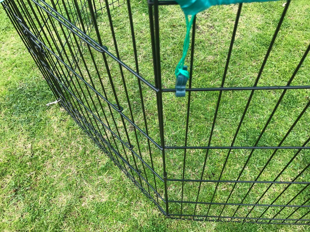 Close-up of YES4PETS 6 panel black steel pet playpen with green cover corner, designed for dogs and cats.