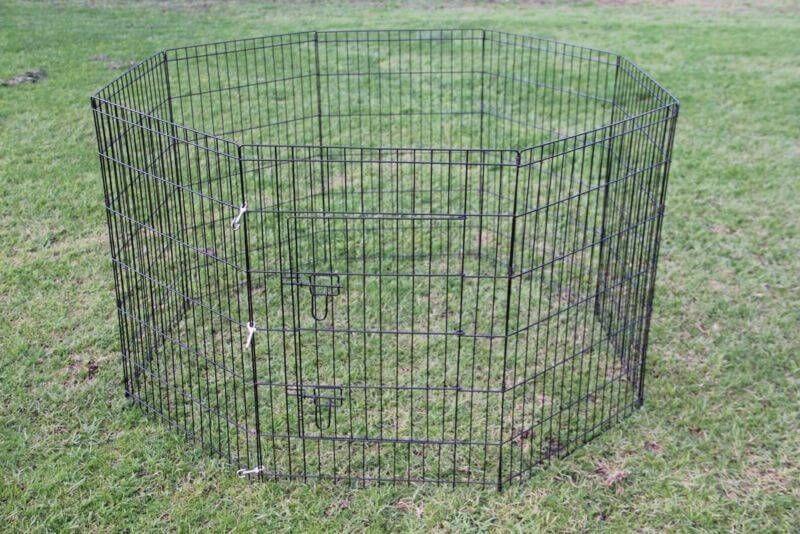 Affordable 42' black dog and cat playpen on grass, customizable 8-panel enclosure for pets.