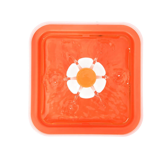 YES4PETS automatic electric pet water fountain in orange, stylish design with flower-shaped water flow.