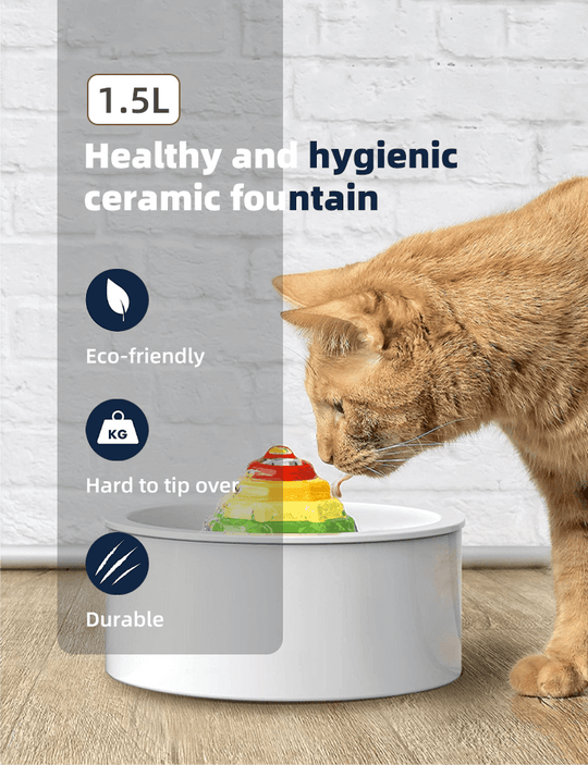 Cat drinking from a 1.5L eco-friendly ceramic pet fountain, designed to be durable and hard to tip over.