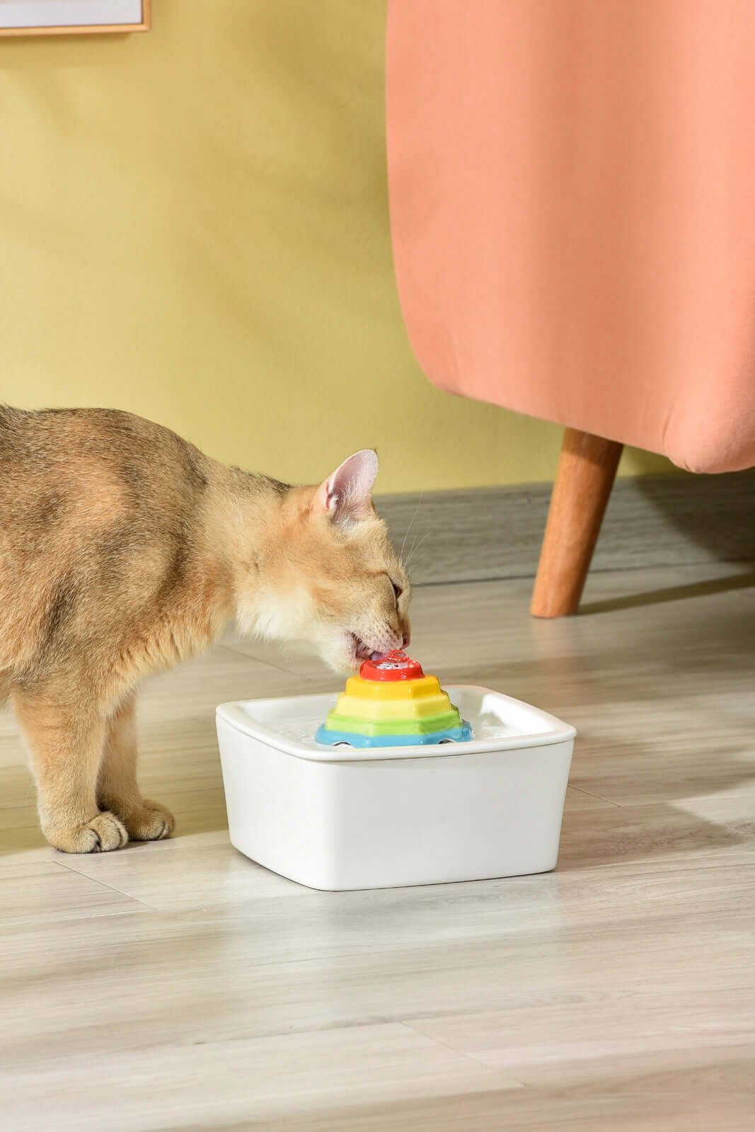 Cat enjoying water from YES4PETS ceramic automatic electric pet water fountain in a stylish setting.