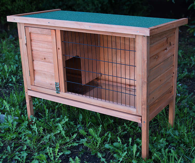 Affordable wooden rabbit hutch with slide-out tray, perfect for guinea pigs and ferrets, designed for durability and comfort.