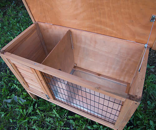 Interior view of YES4PETS wooden hutch with wire mesh for rabbits or guinea pigs, featuring a spacious design and access door.