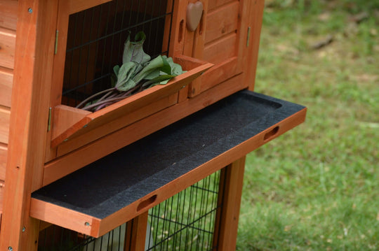 Close-up of YES4PETS double storey rabbit hutch with pull-out tray and hinged access door for easy cleaning.