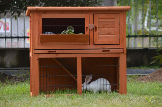 Double storey rabbit hutch with wooden finish, ideal for rabbits, guinea pigs, and ferrets, featuring accessible doors and pull-out tray.