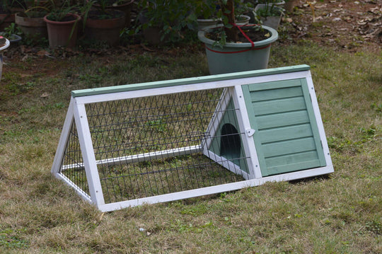 Affordable YES4PETS rabbit hutch and guinea pig cage with access door on grass outdoor setting.