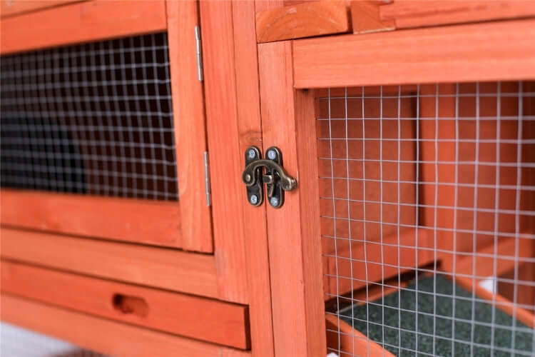 Close-up of a wooden rabbit hutch door with wire mesh and latch, designed for affordable and quality pet care.