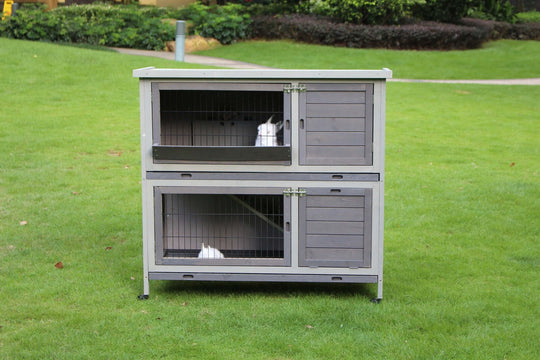 YES4PETS 110cm XL Double Storey Rabbit Hutch with large access doors, perfect for small animals in a grassy outdoor setting.