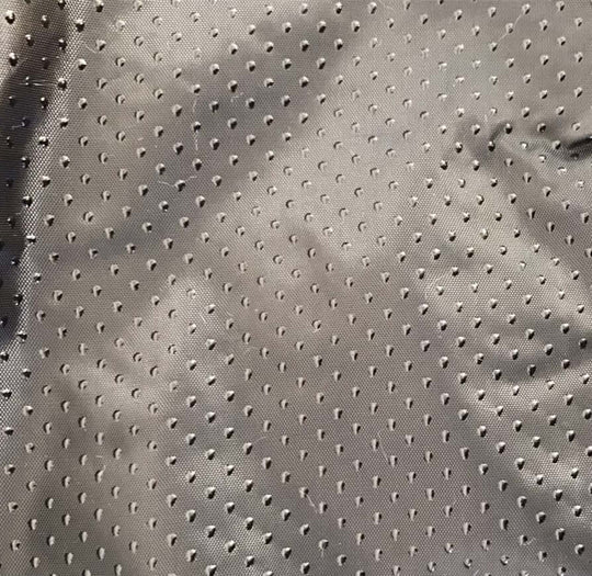 Close-up of grey fabric with small perforations, showcasing a soft texture, ideal for pet products.