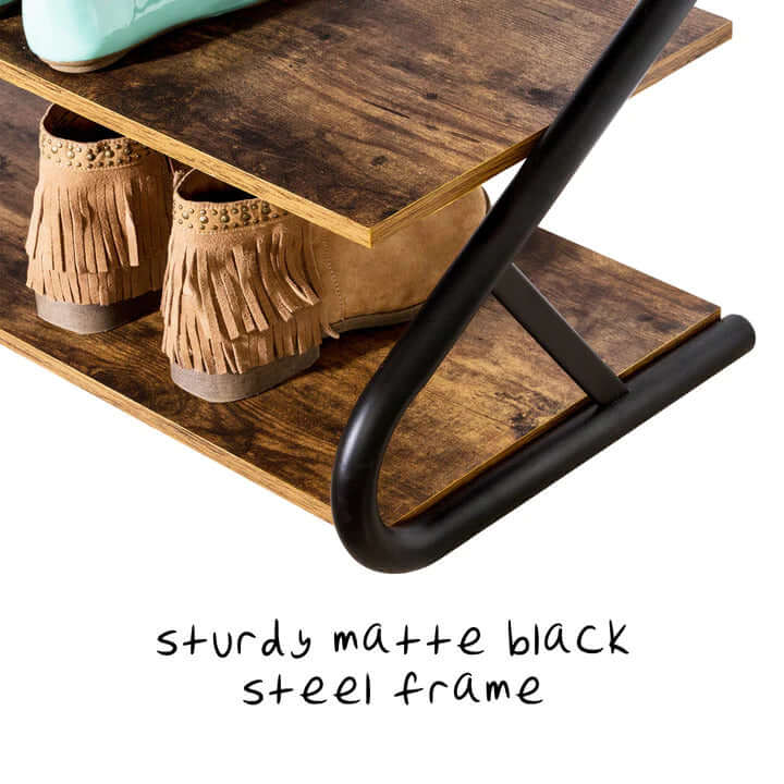 Sturdy matte black steel frame of a rustic 3-tier shoe rack with stylish wooden shelves showcasing boots. Affordable DIY storage solution.