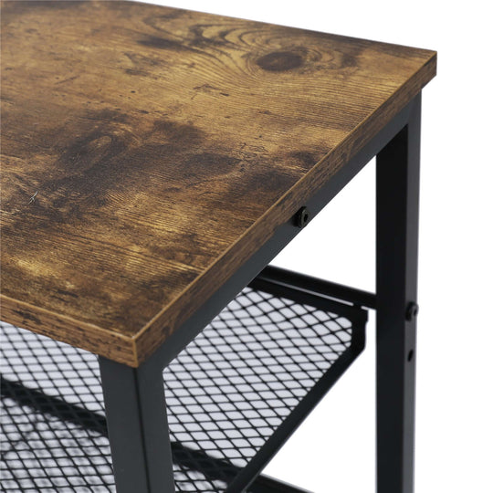 Close-up of a wooden tabletop with a rustic finish on a sturdy metal frame, showcasing quality craftsmanship and design.