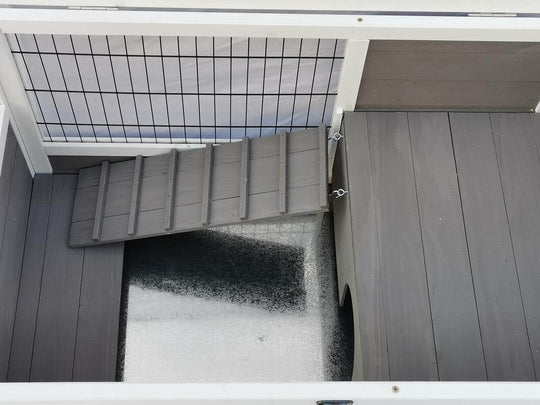 Interior view of YES4PETS Rabbit Hutch with ramp, designed for small pets like rabbits and guinea pigs, showing waterproof features.