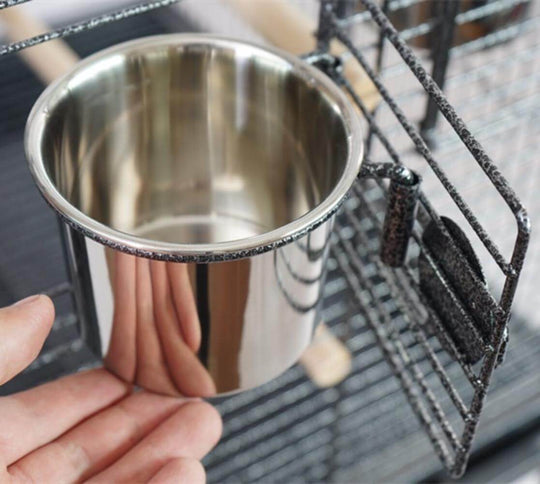 Stainless steel feeding bowl for bird cages, designed for easy access and cleaning.