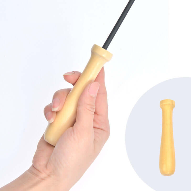 Hand holding a wooden handle tool with a long black rod, ideal for DIY projects or crafting.