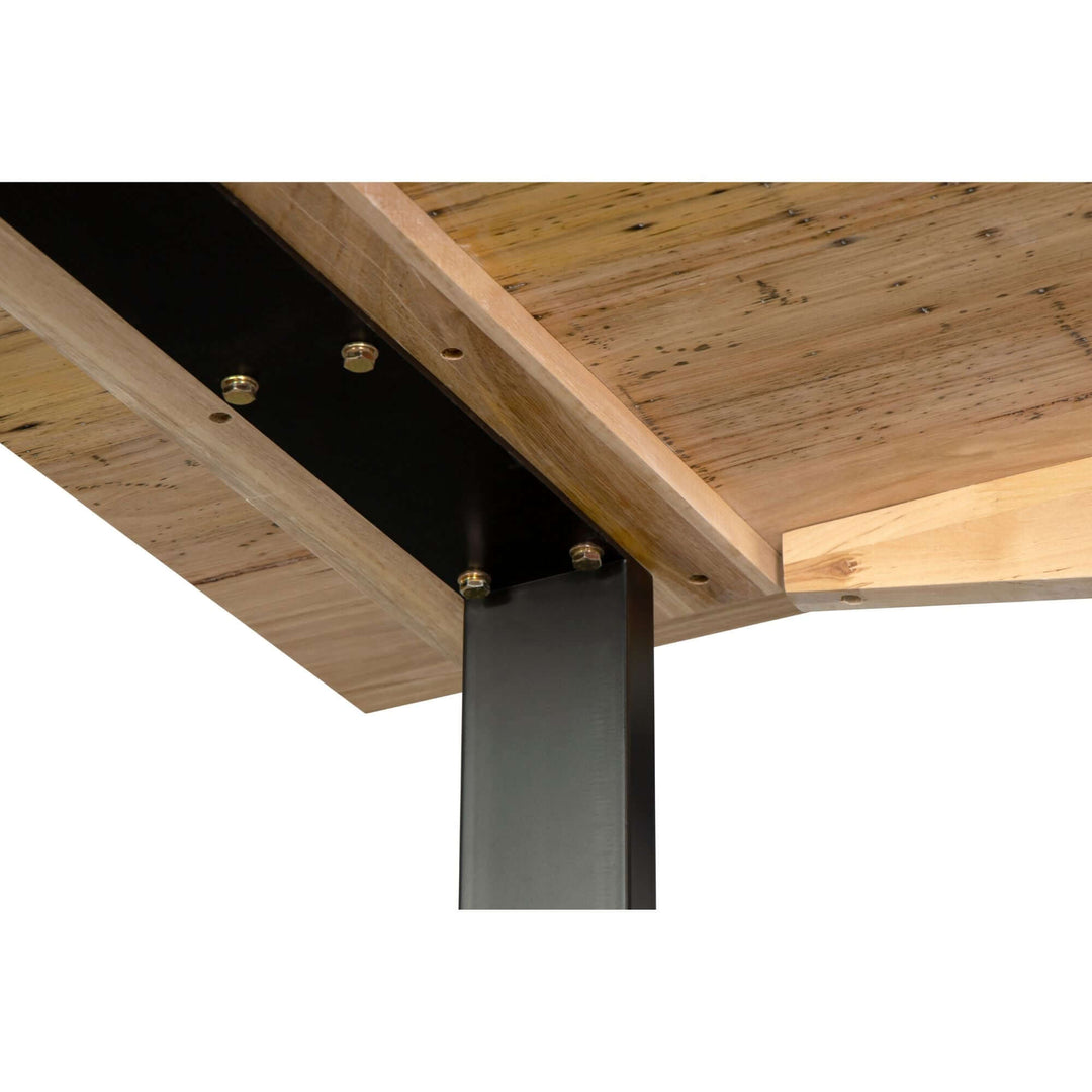 Close-up of solid messmate timber wood used in Aconite 180cm dining table with sturdy black metal support.