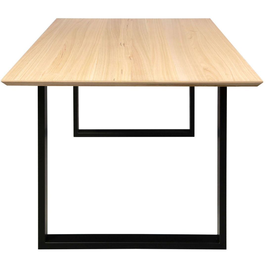 Solid messmate timber dining table with modern design and black metal frame, part of the Aconite 9-piece 210cm dining table set.