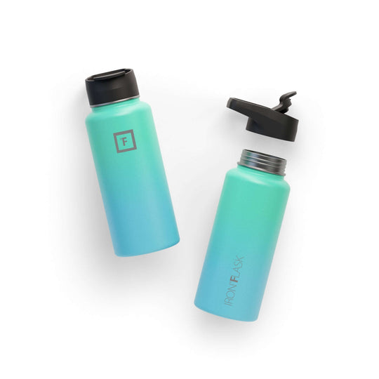 Iron Flask 32oz Wide Mouth Bottle in Sky color with spout lid, lightweight and stylish for any adventure.