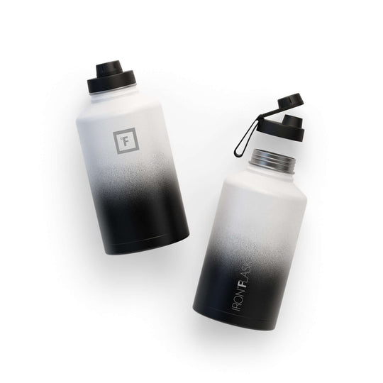 Iron Flask 64oz Wide Mouth Bottle with Spout Lid in black and white design, stylish and durable water bottle.