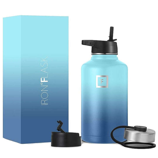 Iron Flask 64oz water bottle in Blue Waves with straw lid, pack, and screw-on lid for hydration on the go.