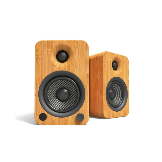 Kanto YU4 powered bookshelf speakers in bamboo finish, showcasing affordable quality sound with a stylish DIY luxe design.