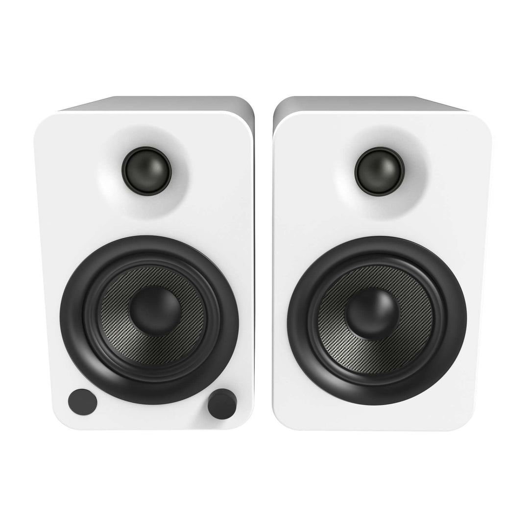 Affordable Kanto YU4 matte white powered bookshelf speakers with Bluetooth and phono preamp for quality sound.